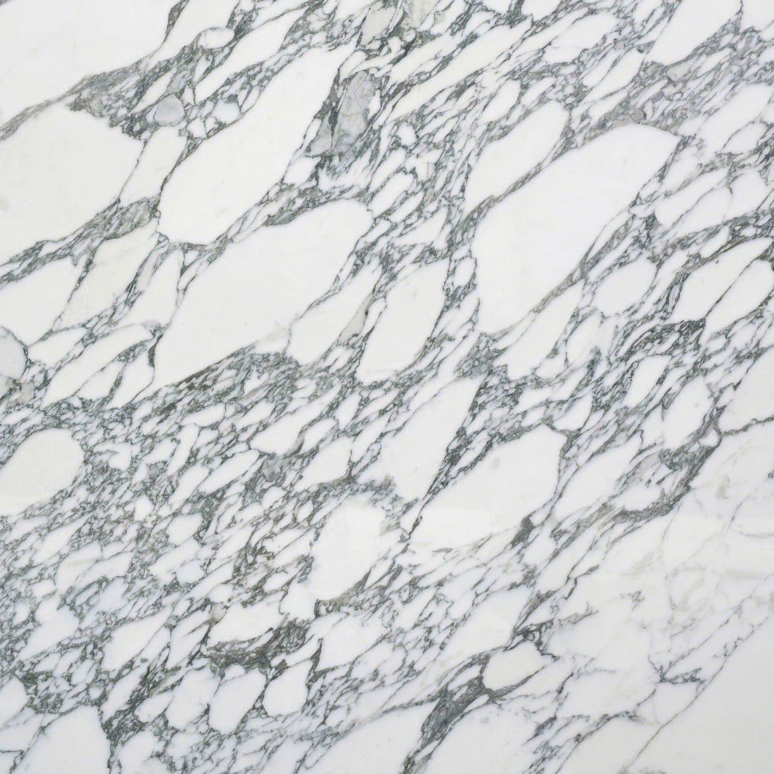 High-contrast Arabescato marble slab featuring bold, dark grey oval-shaped veining on a bright white background for luxury kitchen design.