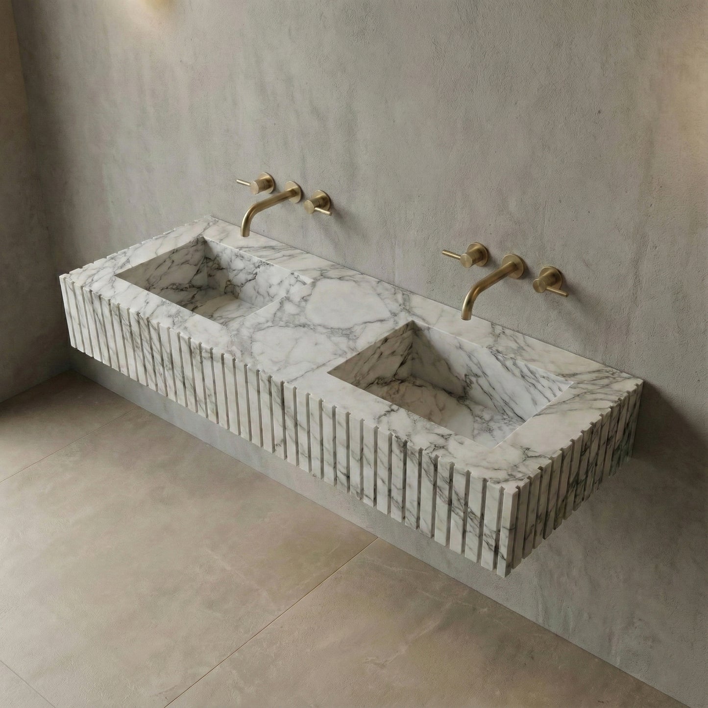 High-angle view of a wall-mounted Arabescato marble sink featuring dual integrated basins and signature dusty grey brecciated veining.