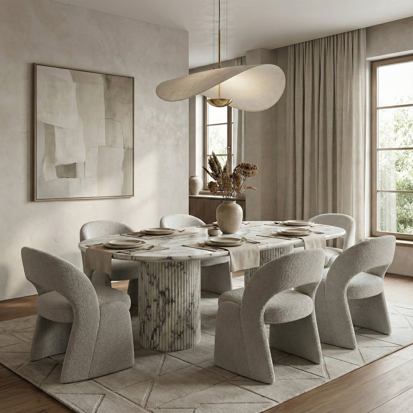 Elegant modern dining room centered on a statement Arabescato marble oval table, paired with textured boucle chairs, a sculptural pendant light, and neutral wall tones.