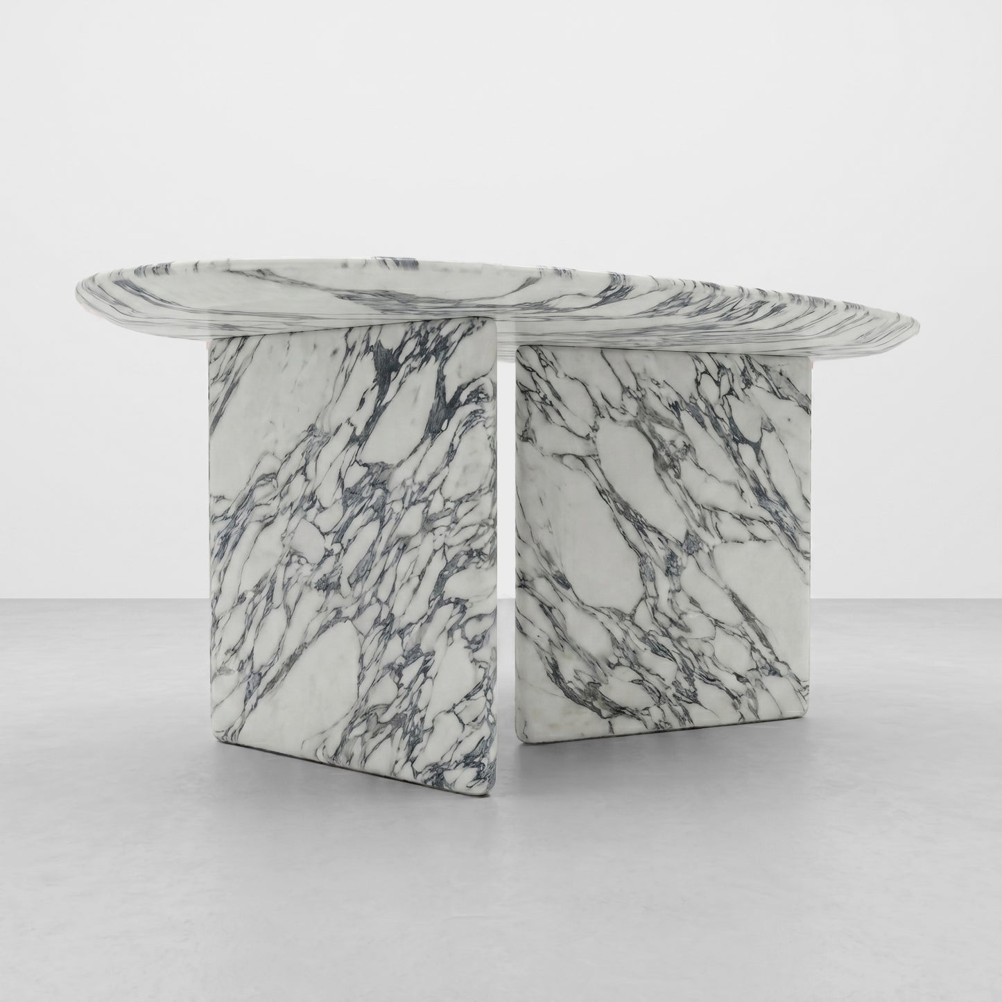 Close-up detail of the natural grey and white veining on the edge of a polished Arabescato marble table, highlighting the high-quality stone texture and craftsmanship.