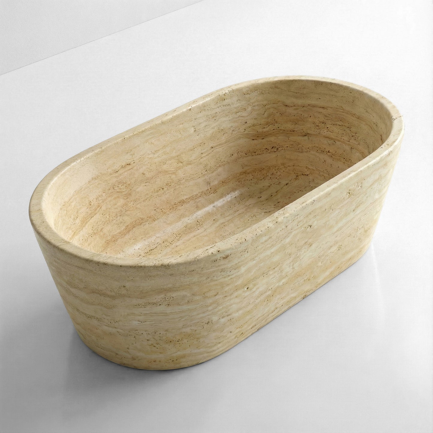High-angle view of a freestanding oval beige Travertine bathtub, revealing a deep soaking interior and natural horizontal stone layers.