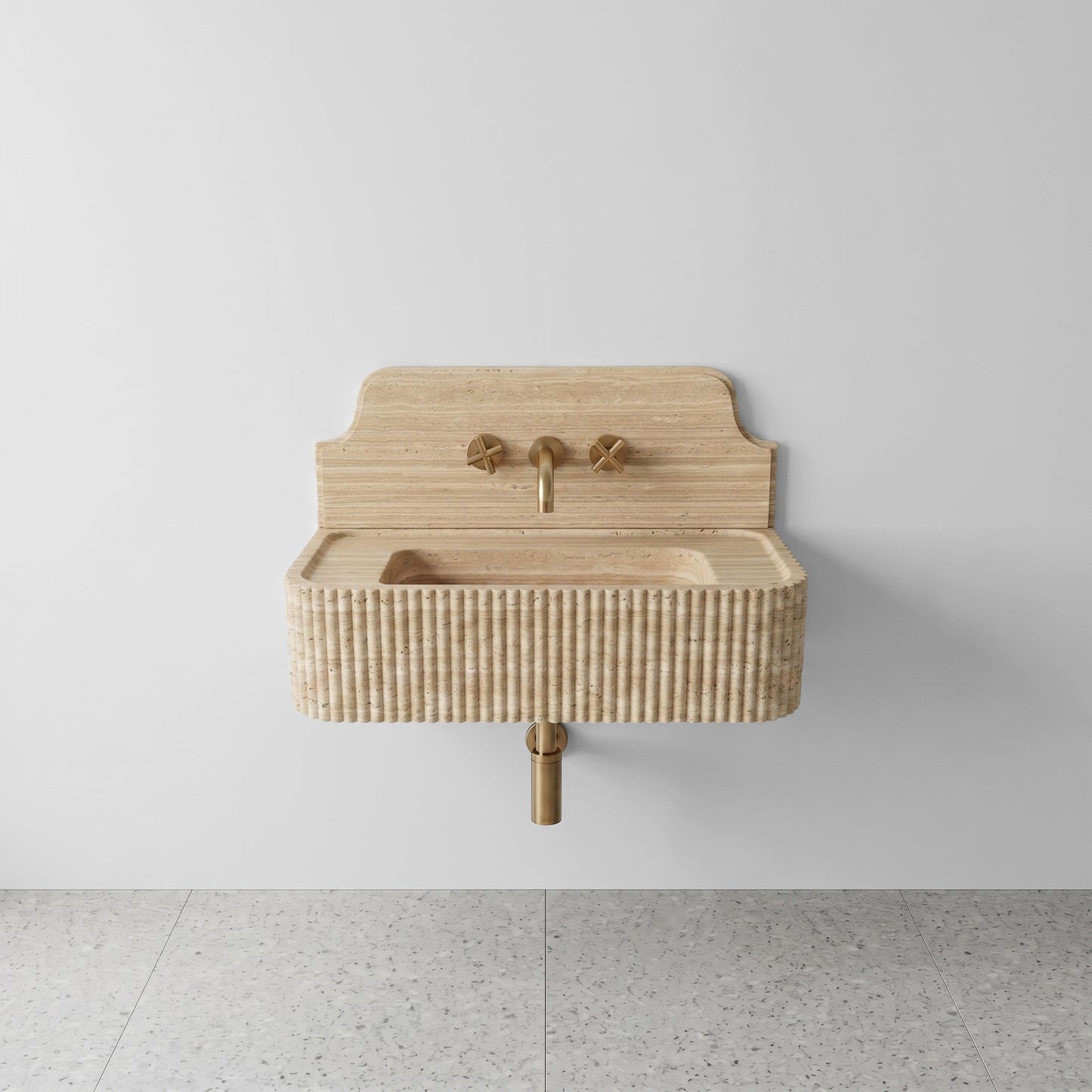 Front profile of a wall-mounted Beige Travertine washbasin featuring a decorative high backsplash, vertical ribbed texture, and warm sandy stone hues.