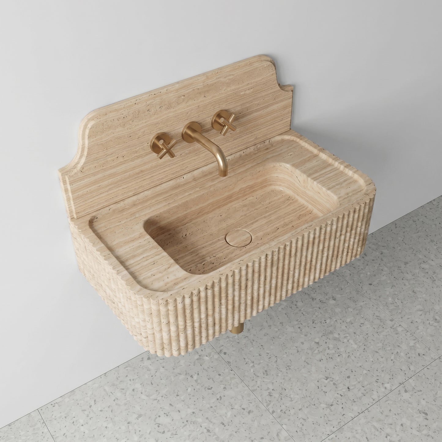 High-angle side view of a vintage-inspired Beige Travertine sink, showcasing the curved stone backsplash, fluted apron, and matte honed finish.