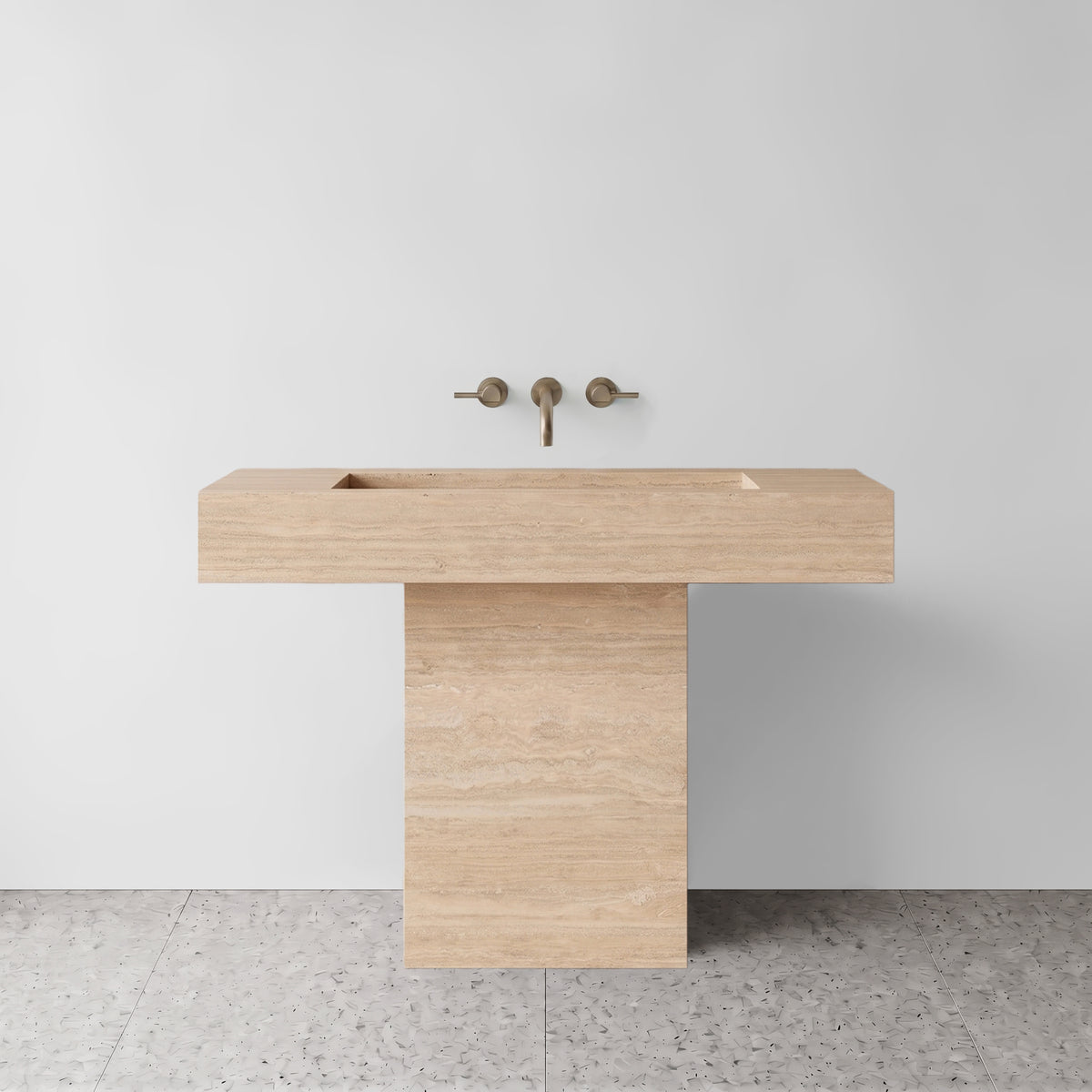 Front view of the Beige Travertine T-shape pedestal sink showcasing its cantilevered basin and plinth base.