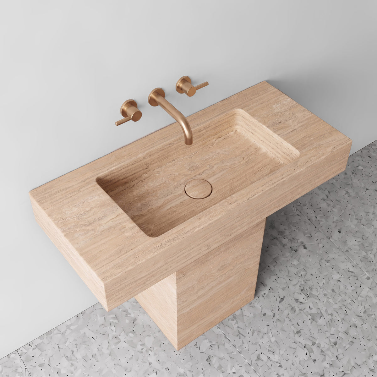 High-angle perspective highlighting the integrated travertine trough basin, matching stone drain cap, and wide counter wings.