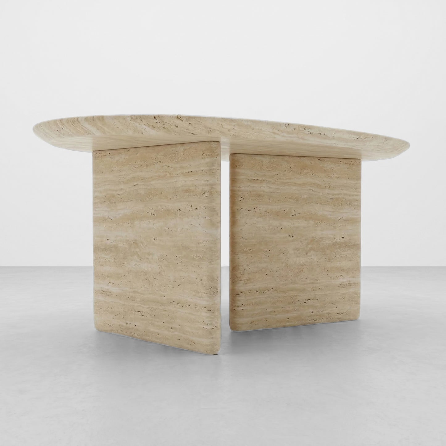 Close-up detail of the natural porous texture and horizontal veining of a beige travertine coffee table with a smooth, radiused edge.