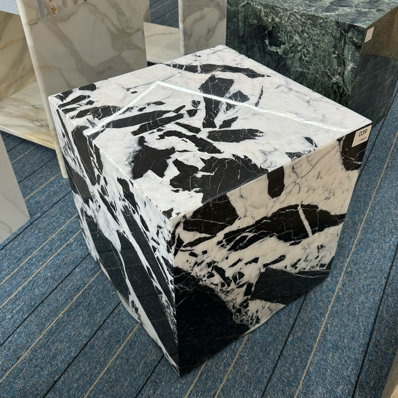 A striking black and white marble plinth (Panda Marble style) with bold natural veining, showcasing precision bespoke stone fabrication for modern high-end furniture by GustavDesign.