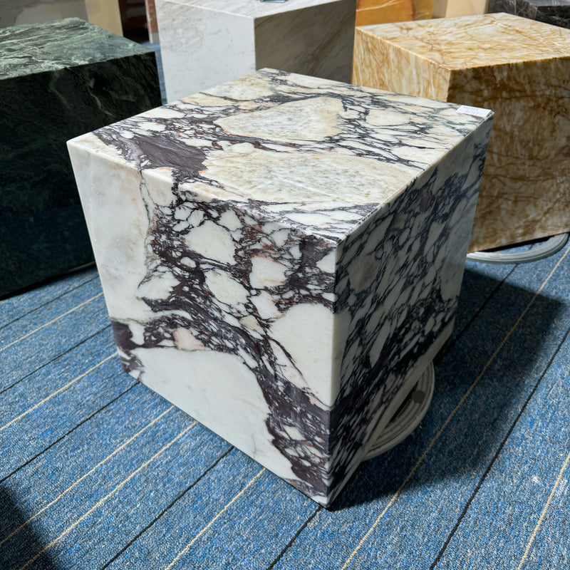 A solid Calacatta Viola marble plinth cube with striking purple and white brecciated patterns, perfect as a luxury side table or display pedestal by GustavDesign.