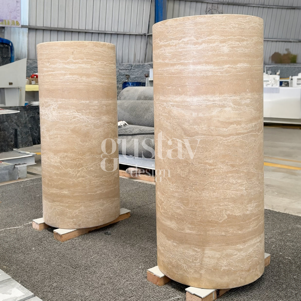 Pair of large cylindrical beige travertine pedestal sinks, handcrafted natural stone plinths by Gustav Design.