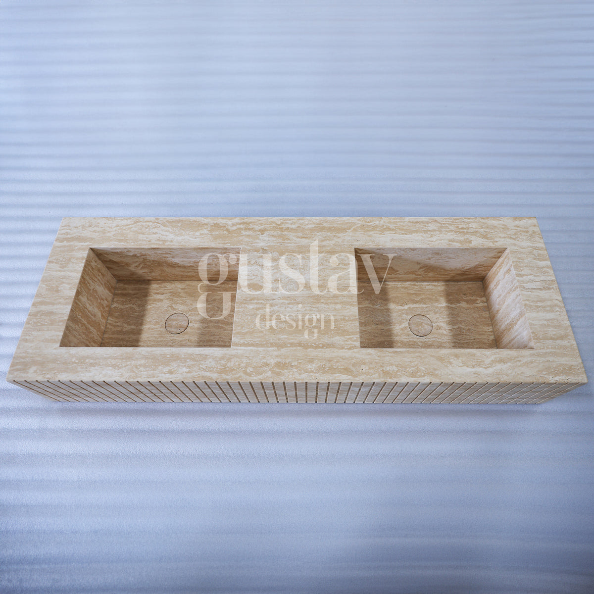 Minimalist beige travertine double sink with a modern ribbed fluted front design, handcrafted by Gustav Design.