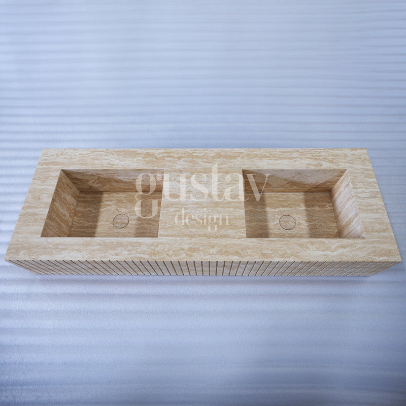 Minimalist beige travertine double sink with a modern ribbed fluted front design, handcrafted by Gustav Design.