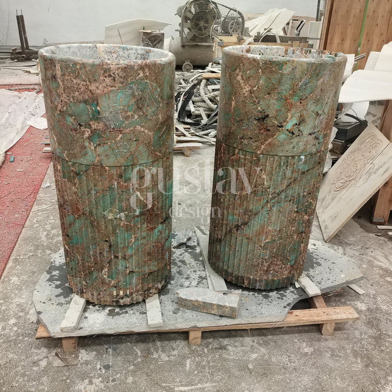 Two exotic green and brown Amazonite stone pedestal sinks with fluted base detailing, unique natural stone washbasins by Gustav Design.