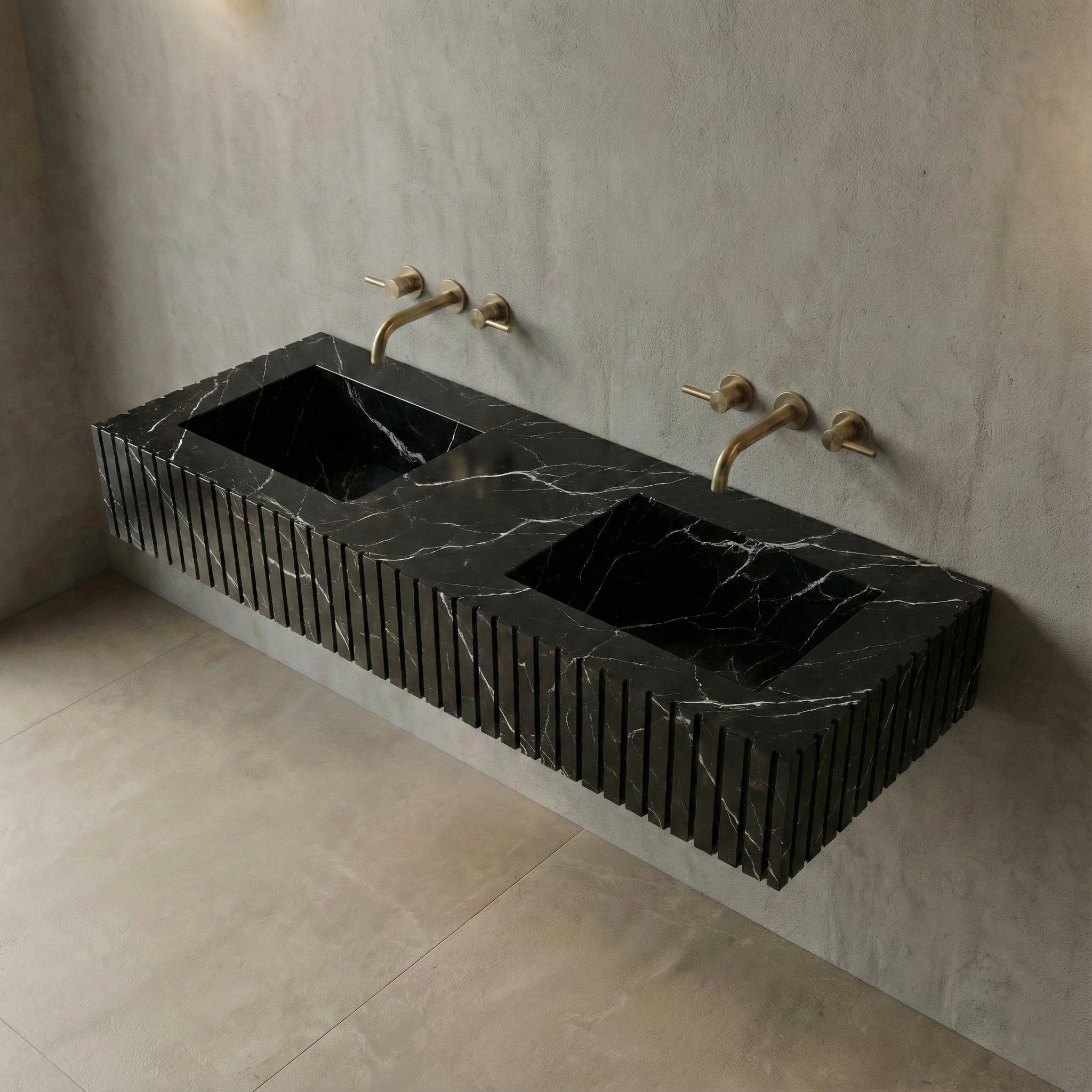 High-angle view of a fluted Black Marquina marble double sink showing sleek integrated rectangular basins and polished black natural stone texture.