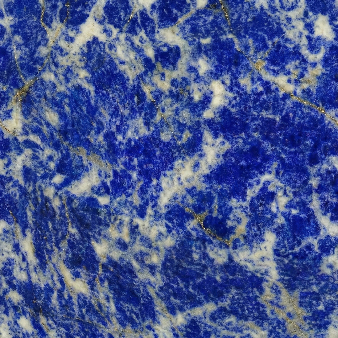 Rare Blue Sodalite stone slab with vibrant cobalt blue tones, white crystalline patches, and golden accents for high-end feature walls.