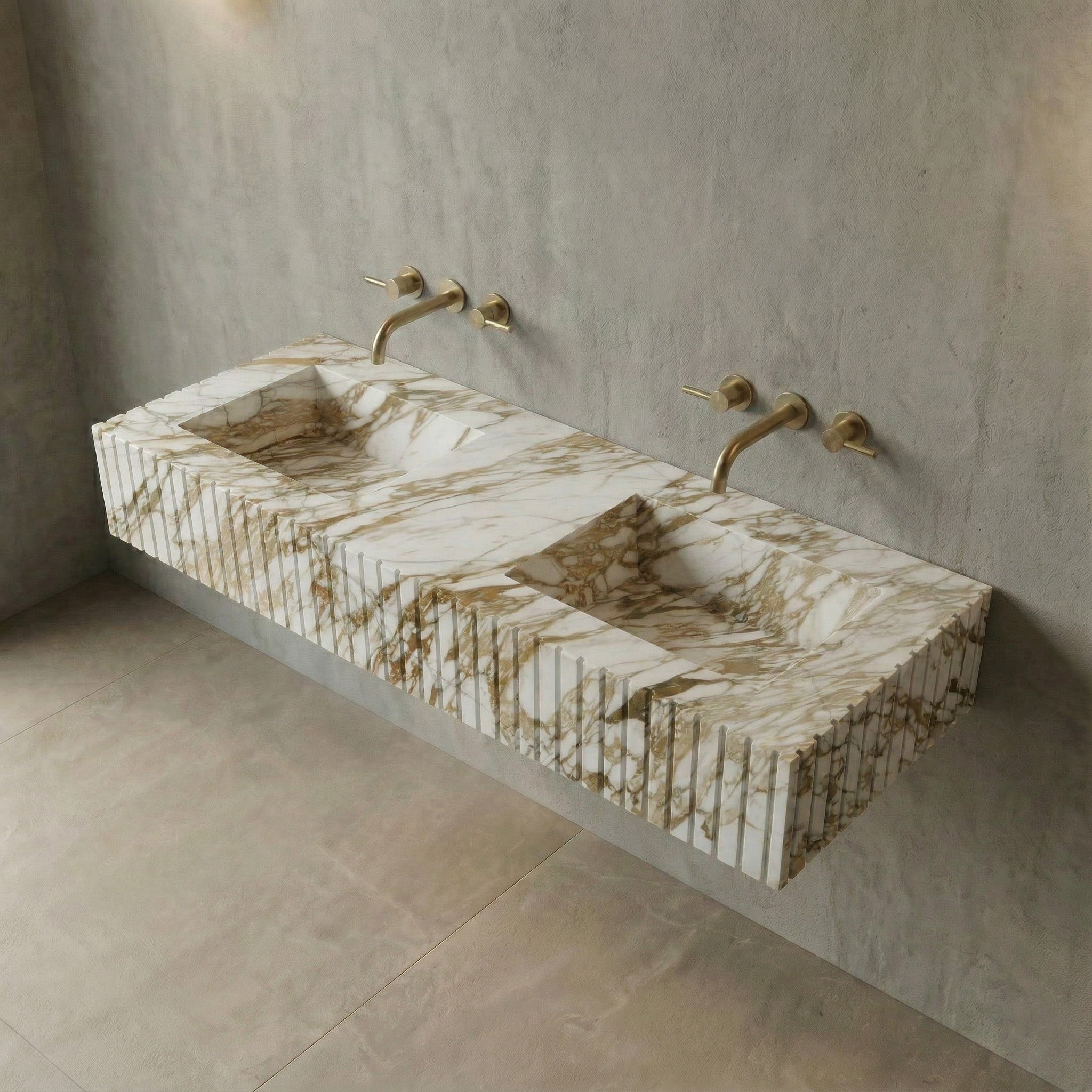 An elevated side view of the floating Calacatta Gold double sink, highlighting the deep rectangular basins and the continuous gold and grey veining across the fluted marble surface.