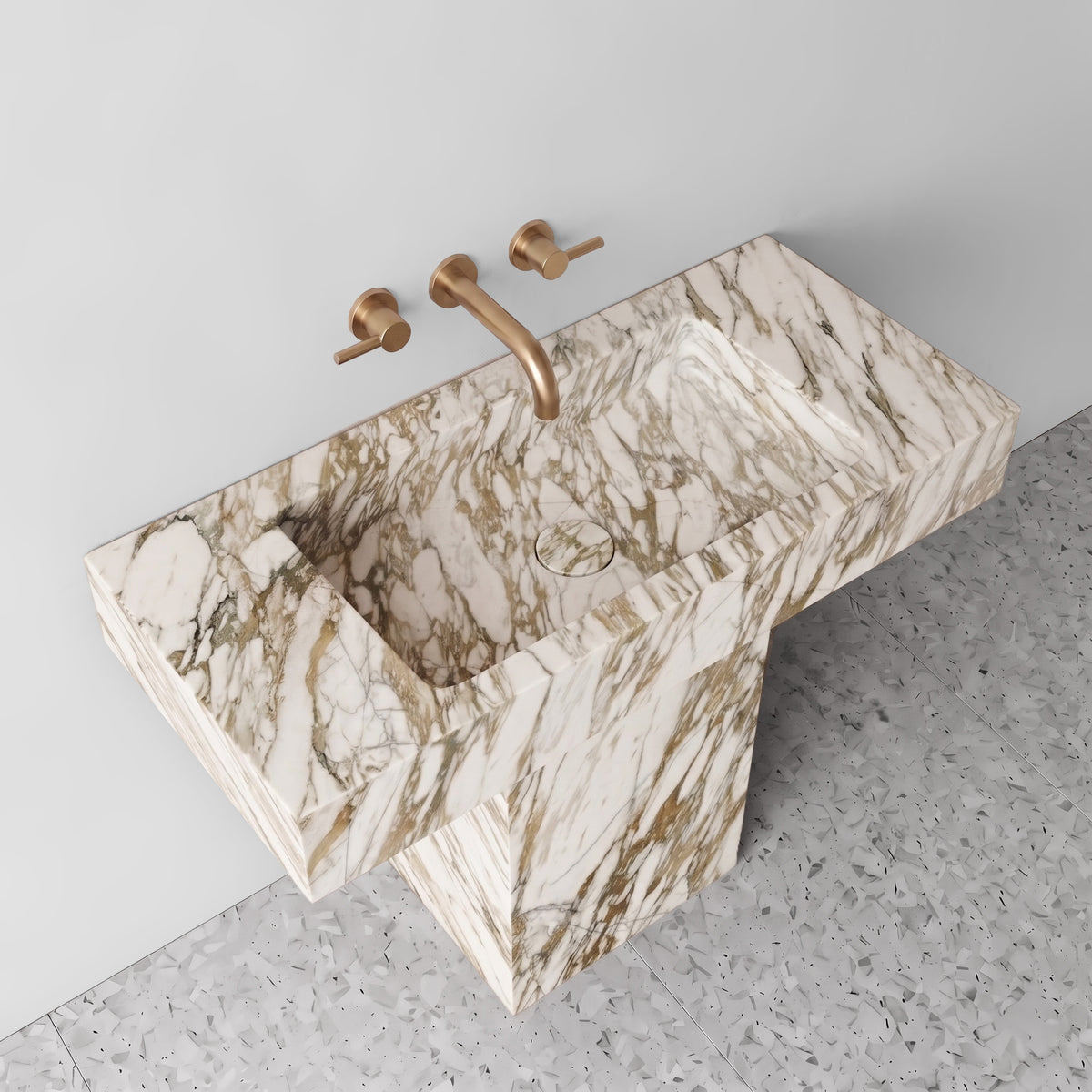 Elevated three-quarter angle showcasing the honey-gold veining, integrated rectangular basin trough, and matching marble drain cover.