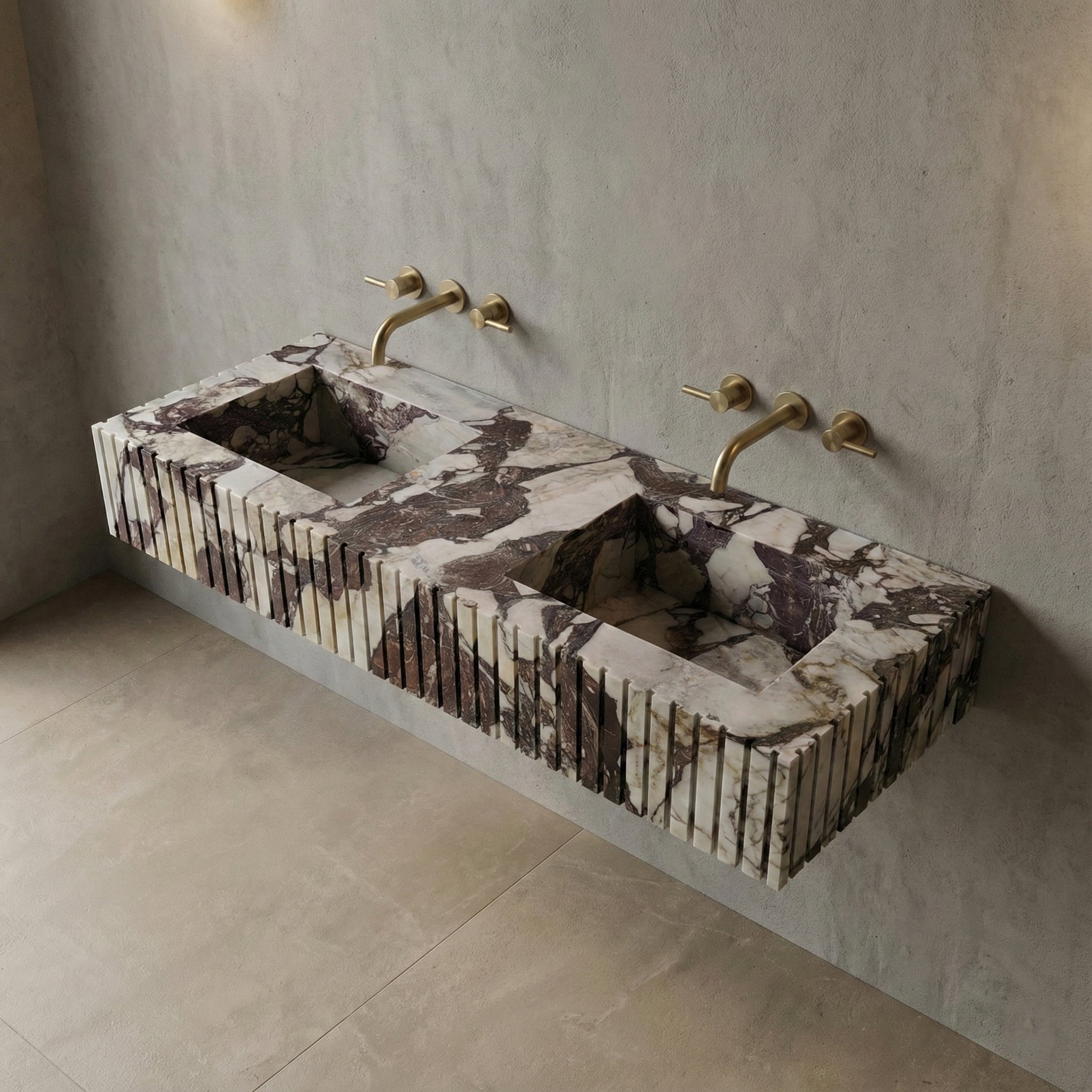 High-angle view of a ribbed Calacatta Viola Extra marble sink, revealing deep integrated basins and intense purple natural stone patterns.