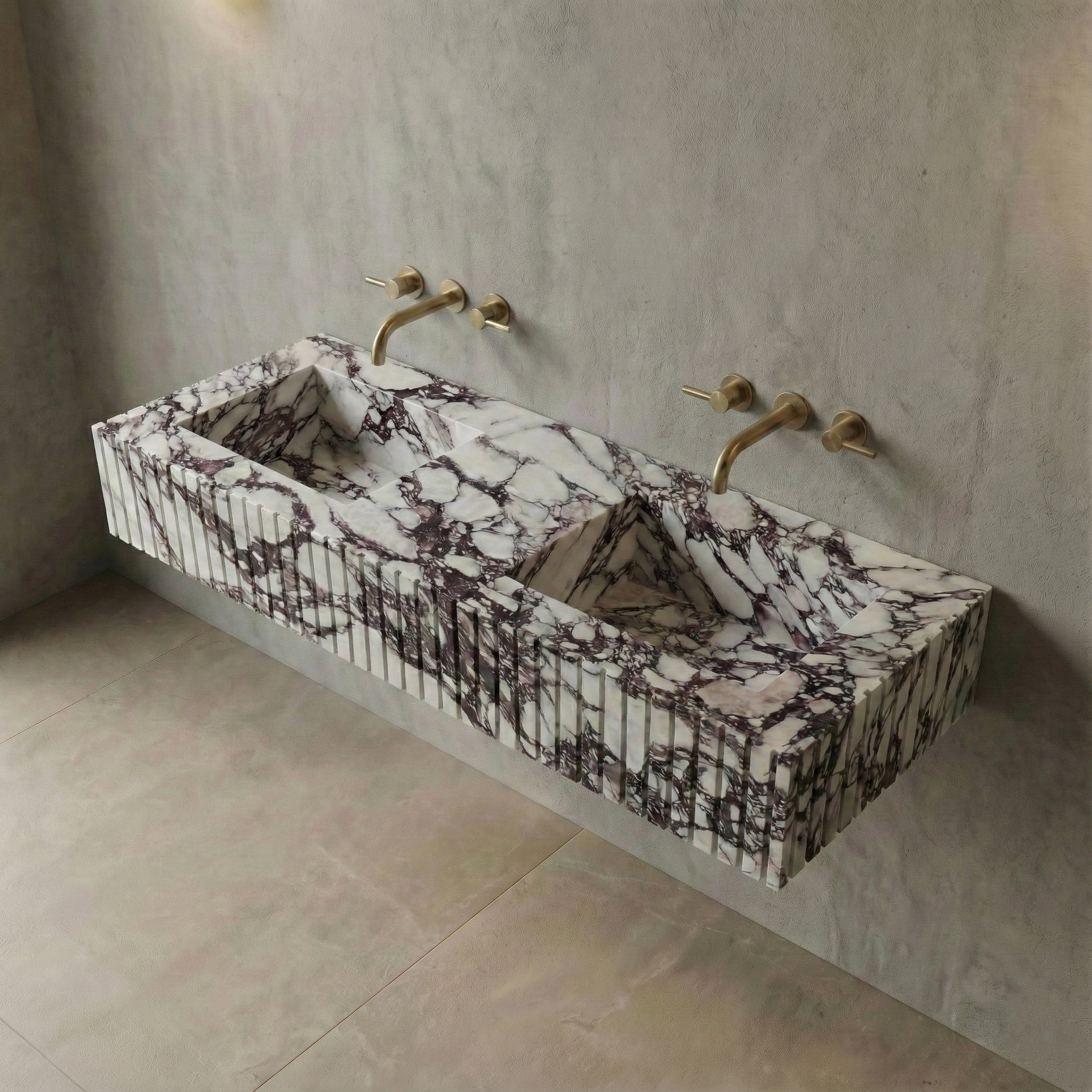 High-angle view of a wall-mounted Calacatta Viola marble sink showcasing deep purple veining, integrated basin slopes, and ribbed detailing.