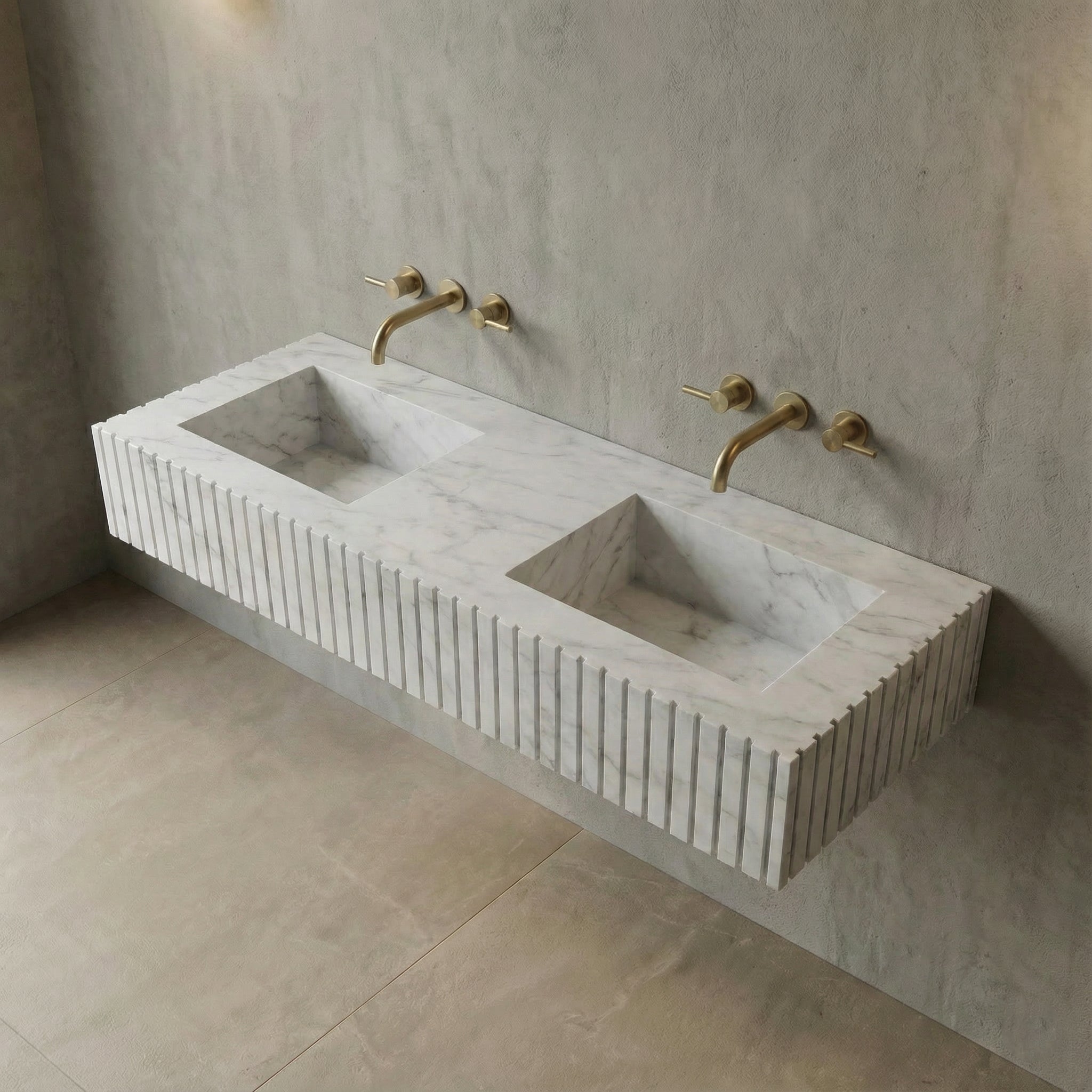 High-angle view of a fluted White Carrara marble sink showing the sleek rectangular integrated basins and subtle soft grey natural stone veining.