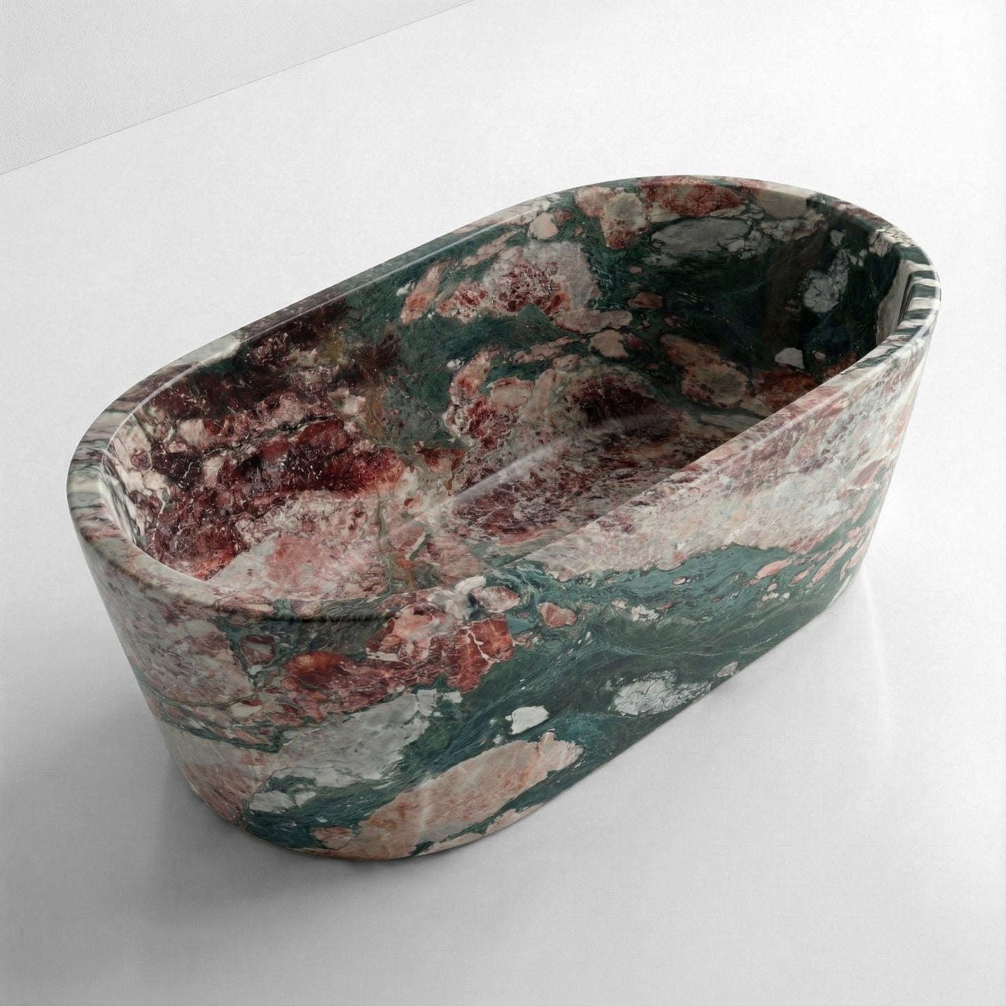 High-angle view of a freestanding oval Four Seasons marble bathtub, displaying a polished interior and a dramatic, colorful mosaic of natural stone veining.