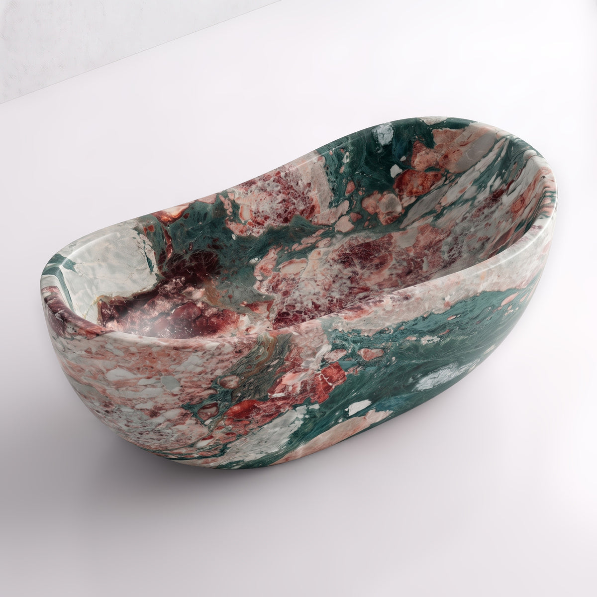 Elevated three-quarter perspective view of the Four Seasons marble wave soaking tub, highlighting the asymmetrical undulating rim, seamless solid-carved interior, and vivid multi-toned breccia mineral ribbons.