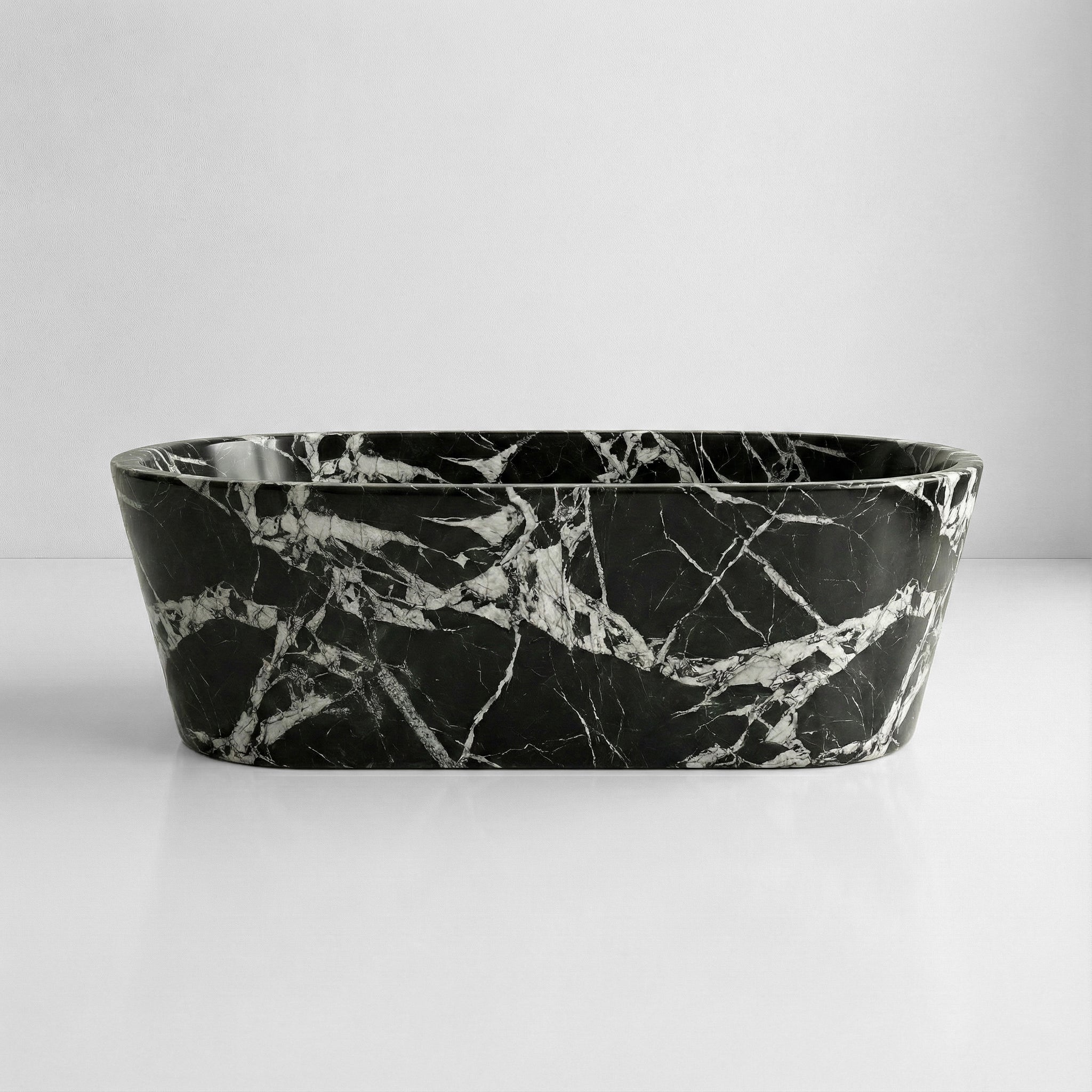 Front profile of a statement Grand Antique marble bathtub with intense black and white coloration, ideal for Art Deco or maximalist bathroom designs.
