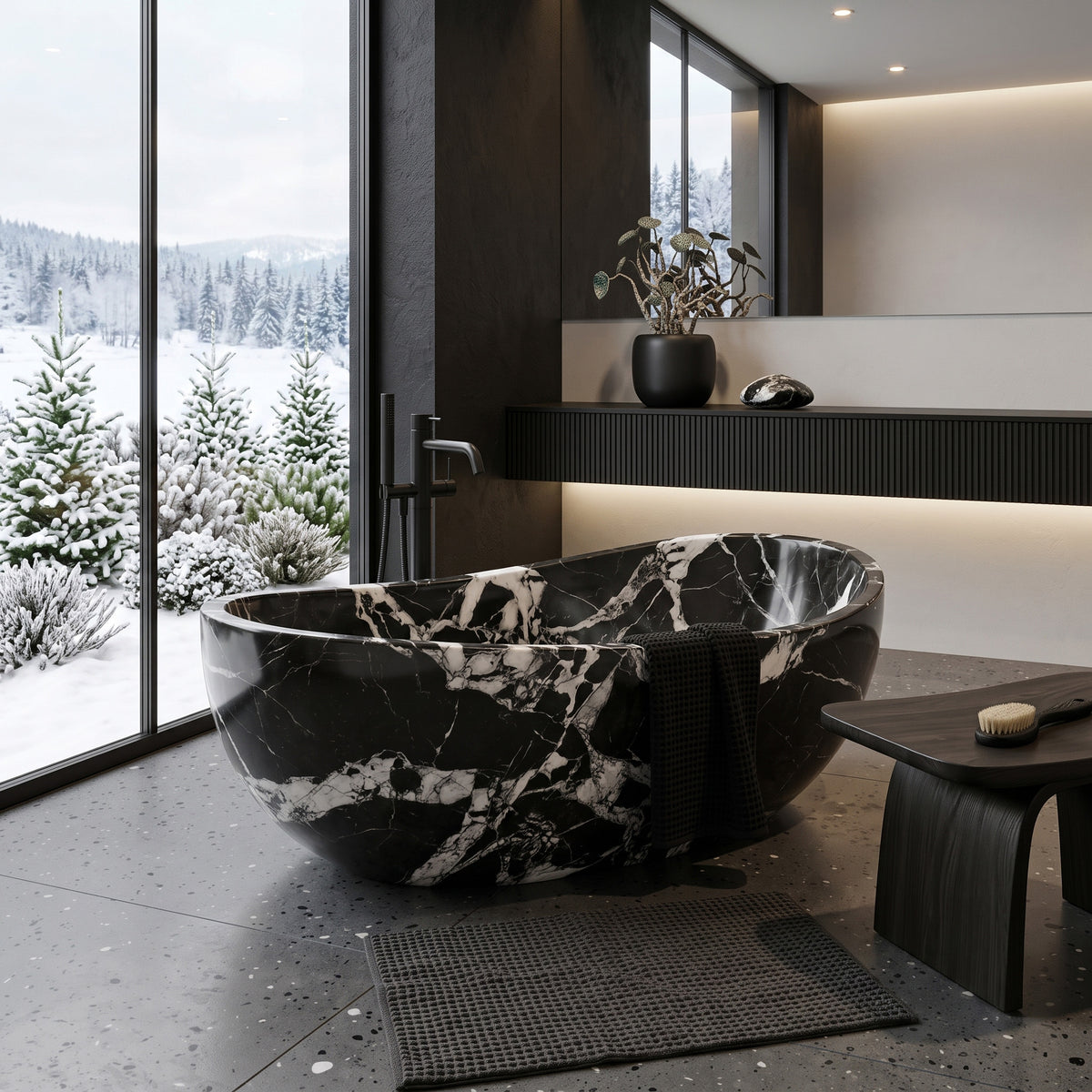 Dramatic luxury bathroom suite featuring the freestanding Grand Antique marble wave bathtub paired with a floor-mounted matte black tub filler, a fluted black vanity shelf with warm under-glow lighting, a dark wood bench, and panoramic windows framing a snowy pine forest.