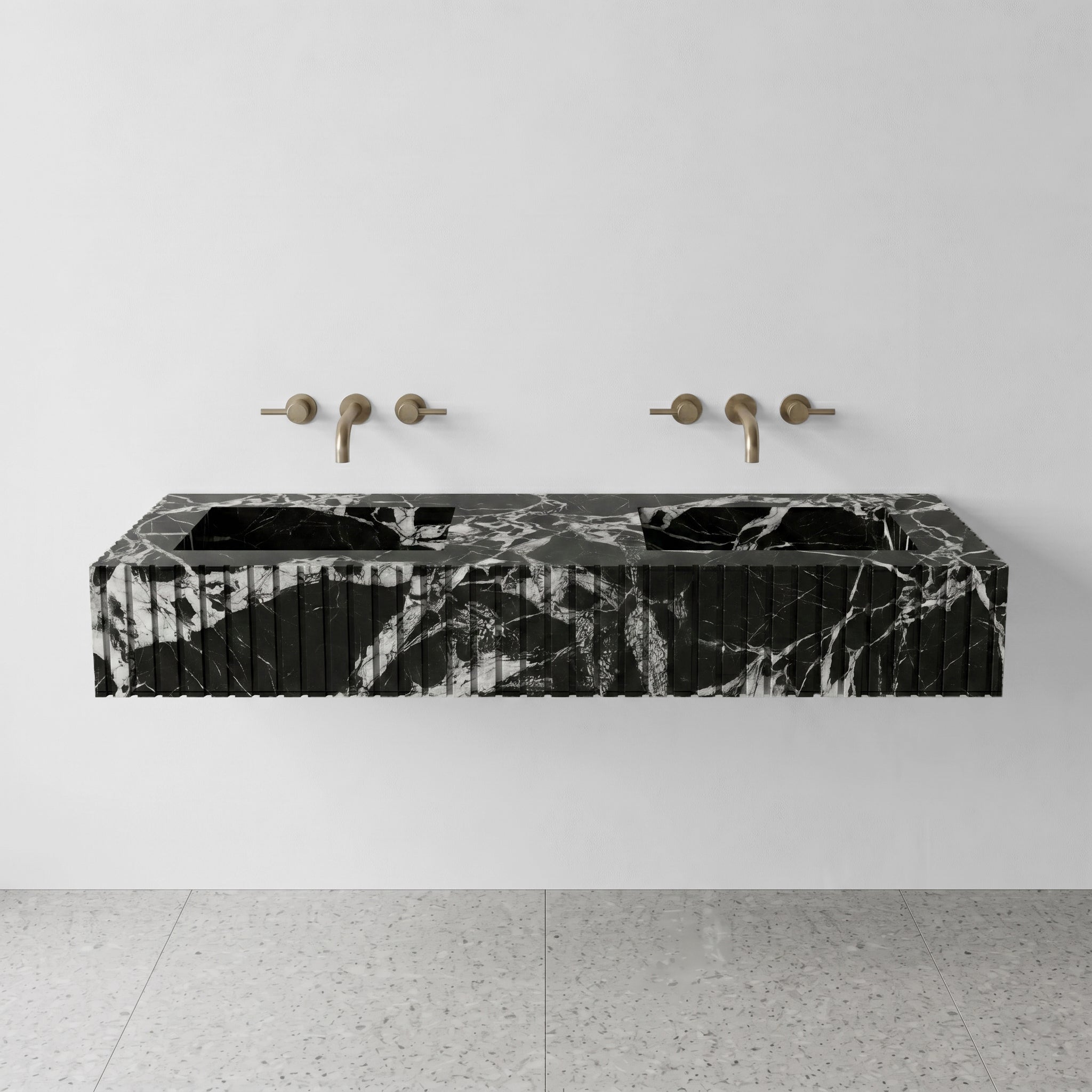 Front profile of a luxury wall-hung double vanity crafted from high-contrast Grand Antique marble, showcasing vertical ribbed detailing and dramatic black and white brecciated patterns.