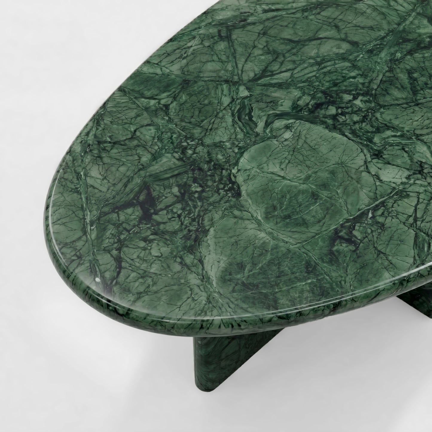 Side profile of a bespoke Green Guatemala marble coffee table featuring a unique sculptural two-pedestal base and an organic pebble-shaped top against a minimalist white background.