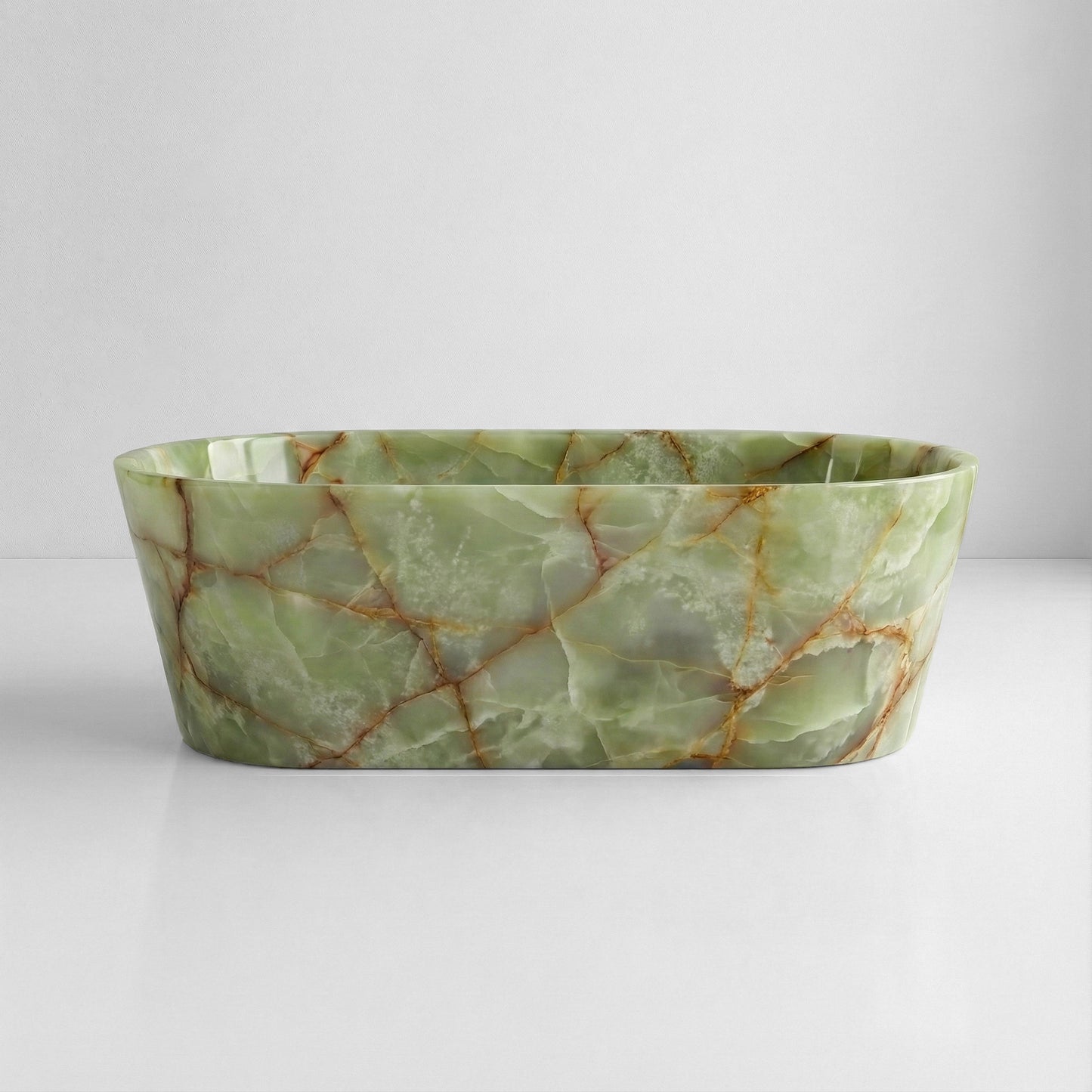 Front profile of a statement Green Onyx gemstone bathtub, displaying a polished finish with characteristic crystalline texture and warm amber veins.