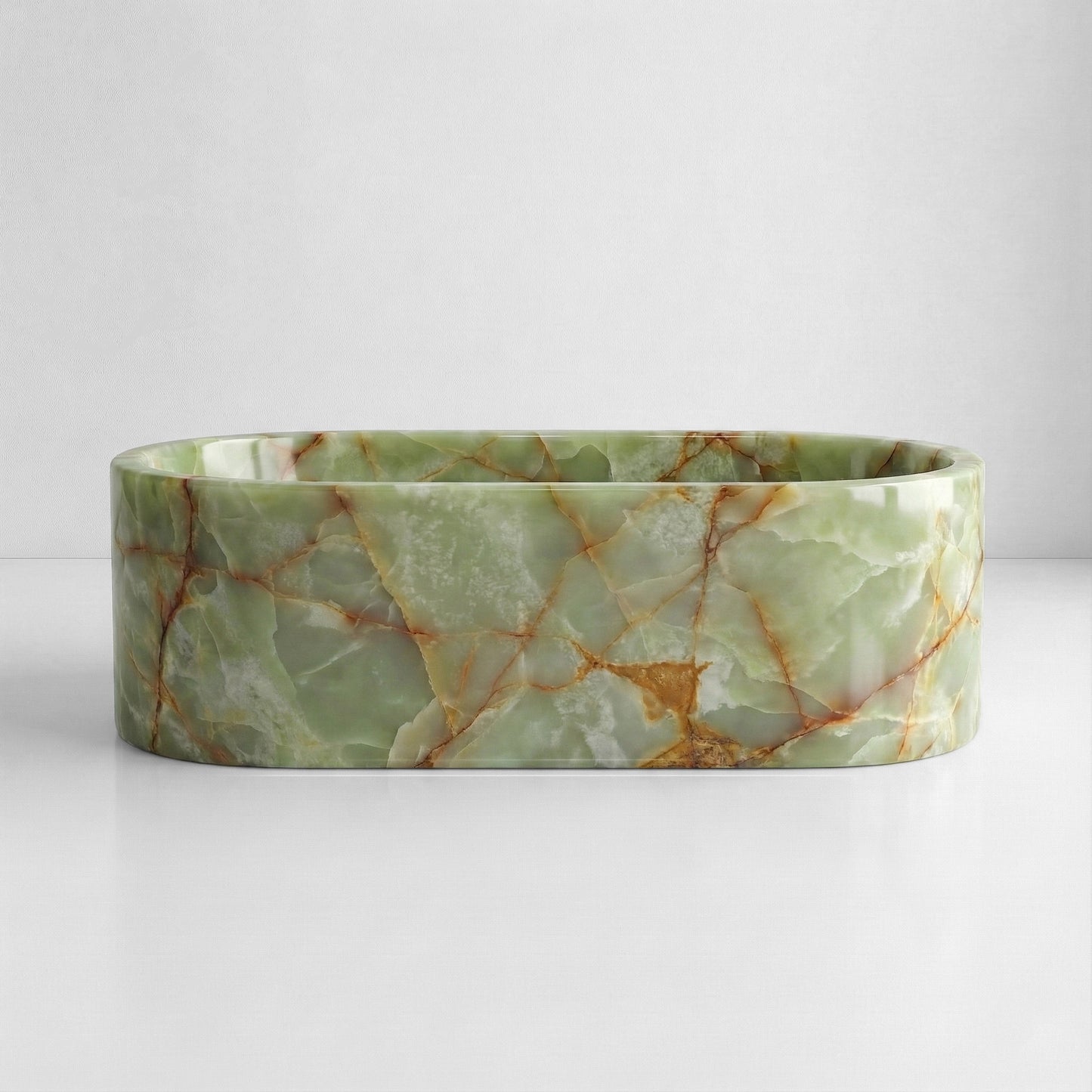 Front elevation of a luxury oval Green Onyx tub displaying a polished finish with soft green tones and natural amber mineral streaks.