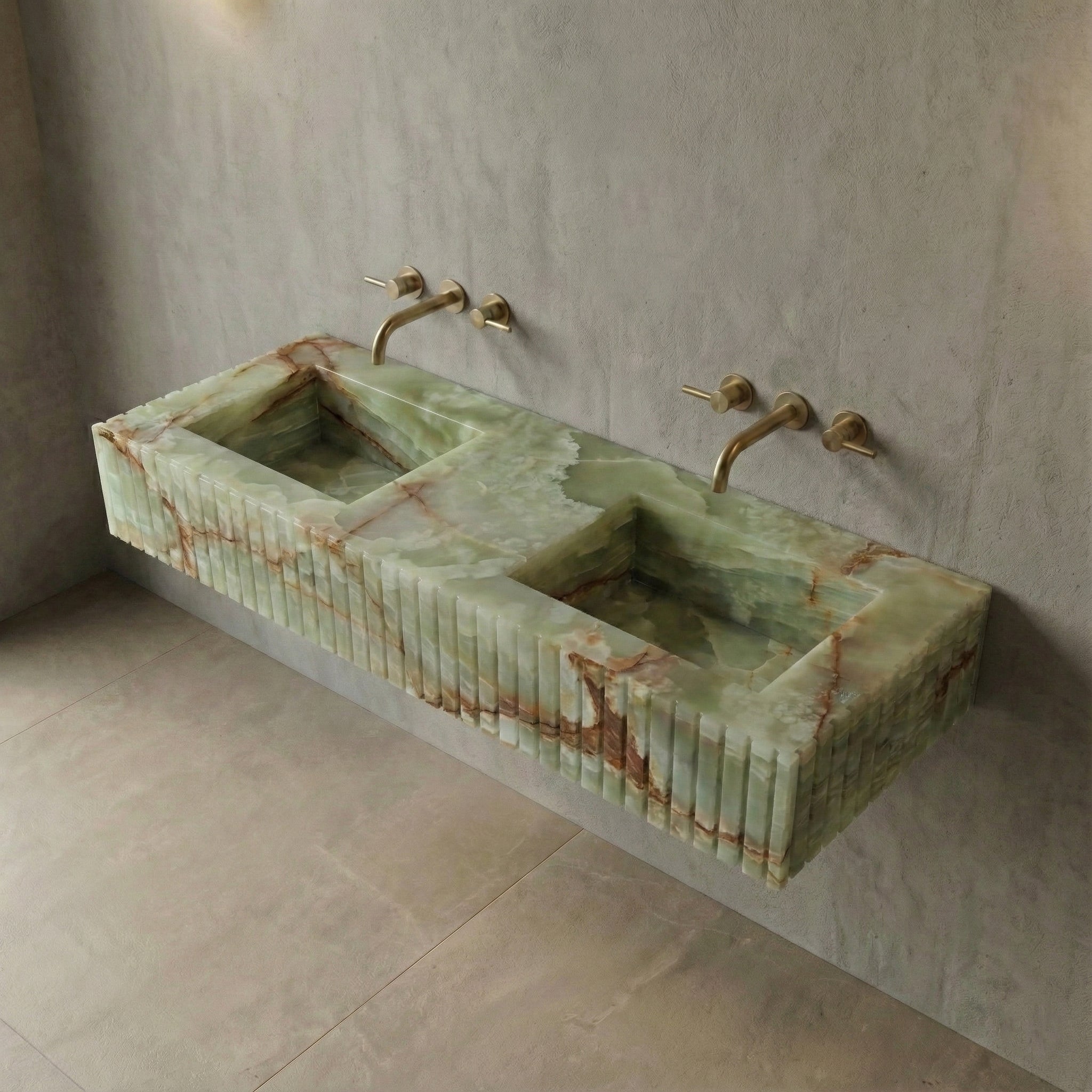 High-angle view of a wall-mounted Green Onyx semi-precious stone sink, showcasing dual integrated basins and intricate natural mineral patterns.