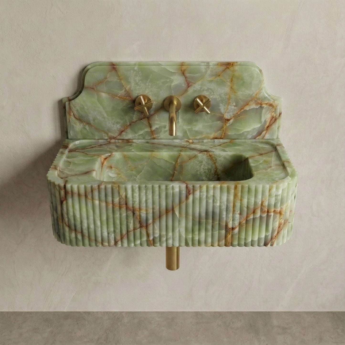 Front profile of a wall-mounted Green Onyx washbasin featuring a decorative high backsplash, vertical ribbed texture, and intricate rust-colored mineral veining.