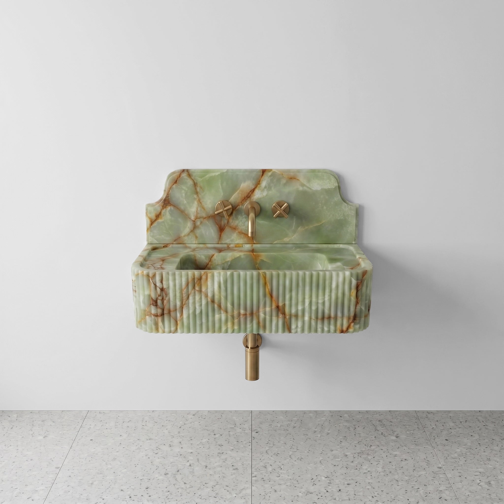 Front profile of a wall-mounted Green Onyx washbasin featuring a decorative high backsplash, vertical ribbed texture, and intricate rust-colored mineral veining.