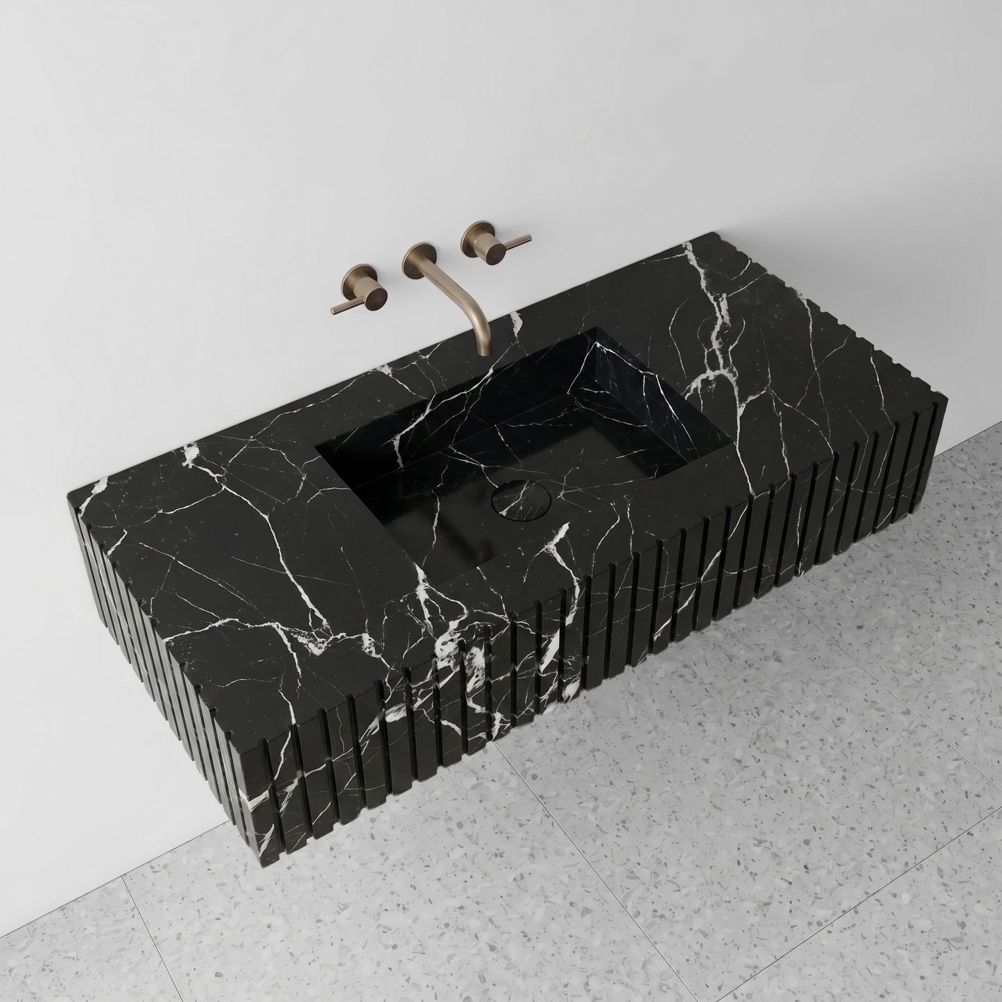 High-angle perspective view of a floating Nero Marquina black marble single vanity, highlighting the crisp white lightning veining across the countertop, an integrated square basin, and terrazzo flooring.