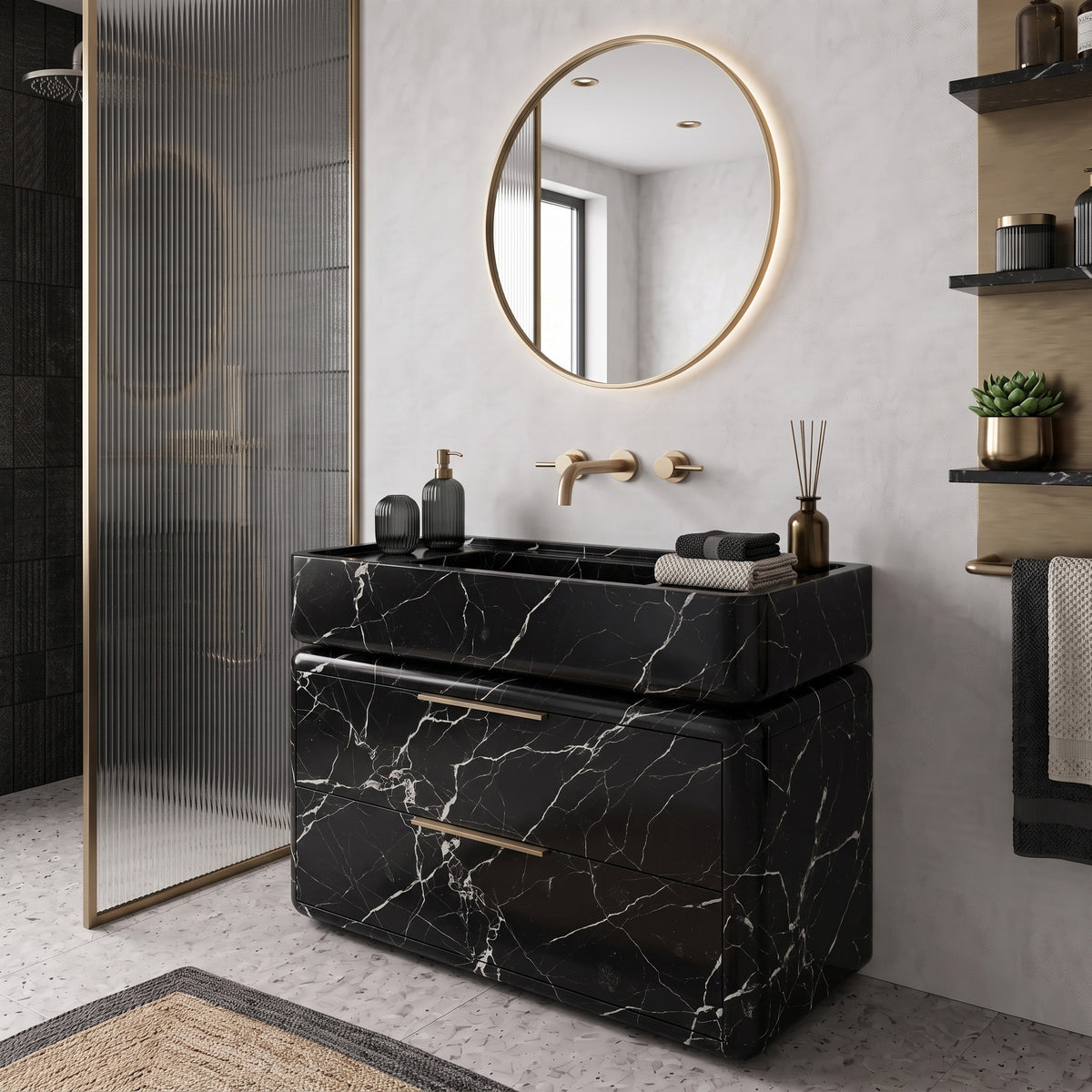 Luxury modern bathroom interior featuring the curved Nero Marquina marble double-drawer vanity paired with wall-mounted brushed brass tapware, a round brass-framed backlit mirror, a fluted glass shower screen, and open shelving on terrazzo flooring.