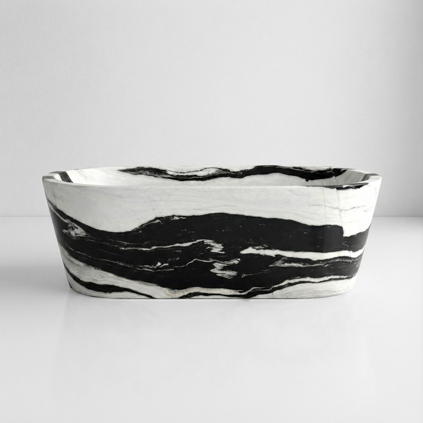 Front profile of a statement Panda White marble bathtub featuring bold, horizontal black stripes flowing across a polished white stone background.