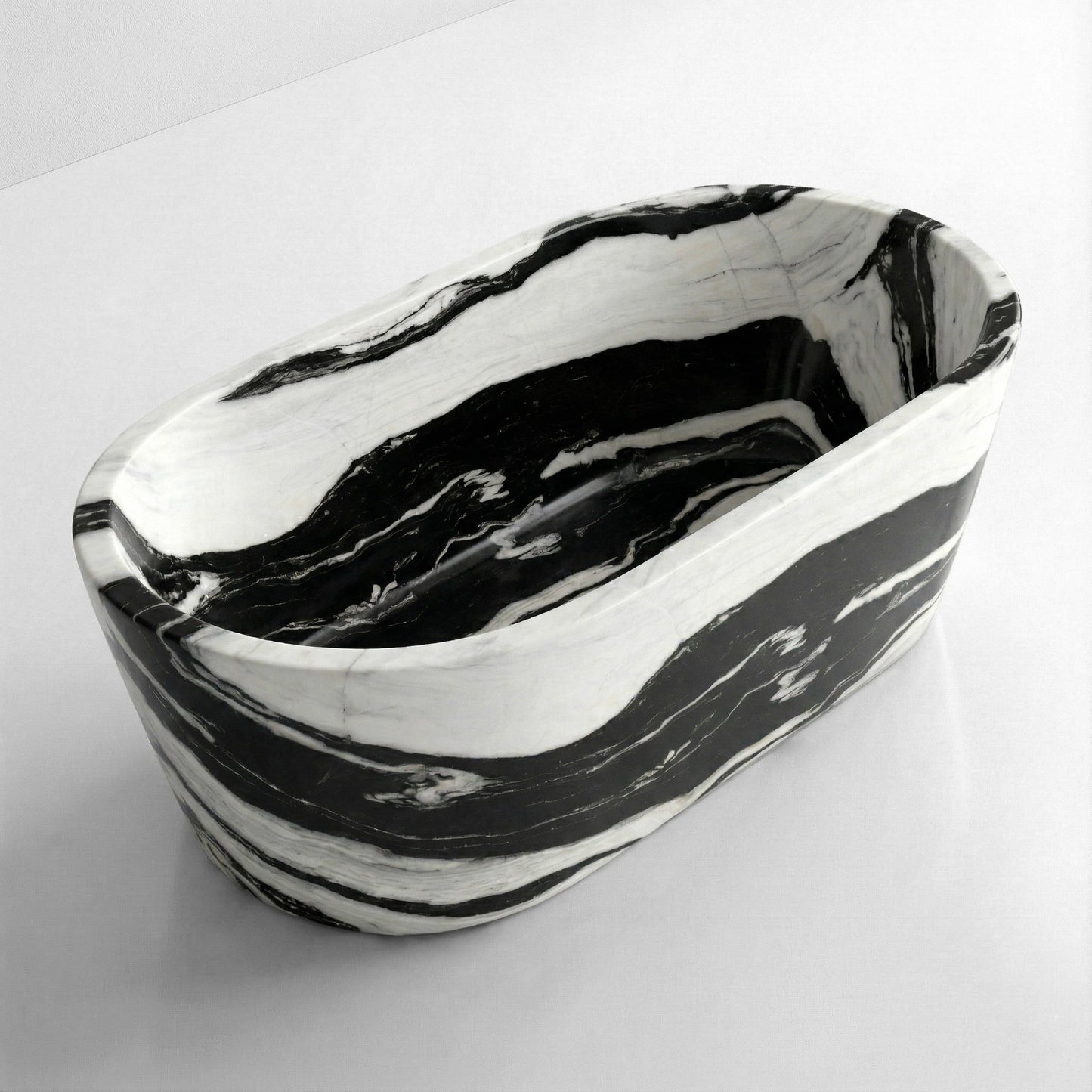 High-angle view of a freestanding oval Panda White marble bathtub, displaying deep contrast and wide monochromatic banding typical of this exotic stone.