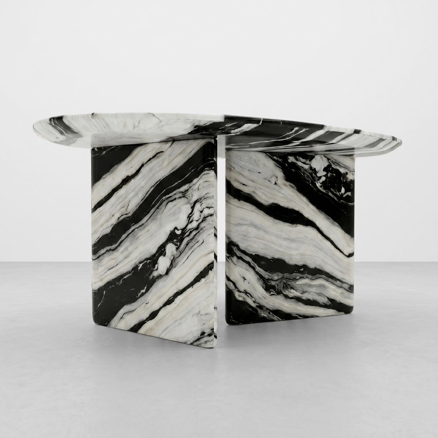 Close-up detail of the polished edge and bold high-contrast wave patterns of a Panda White marble table, highlighting the premium natural stone texture and craftsmanship.