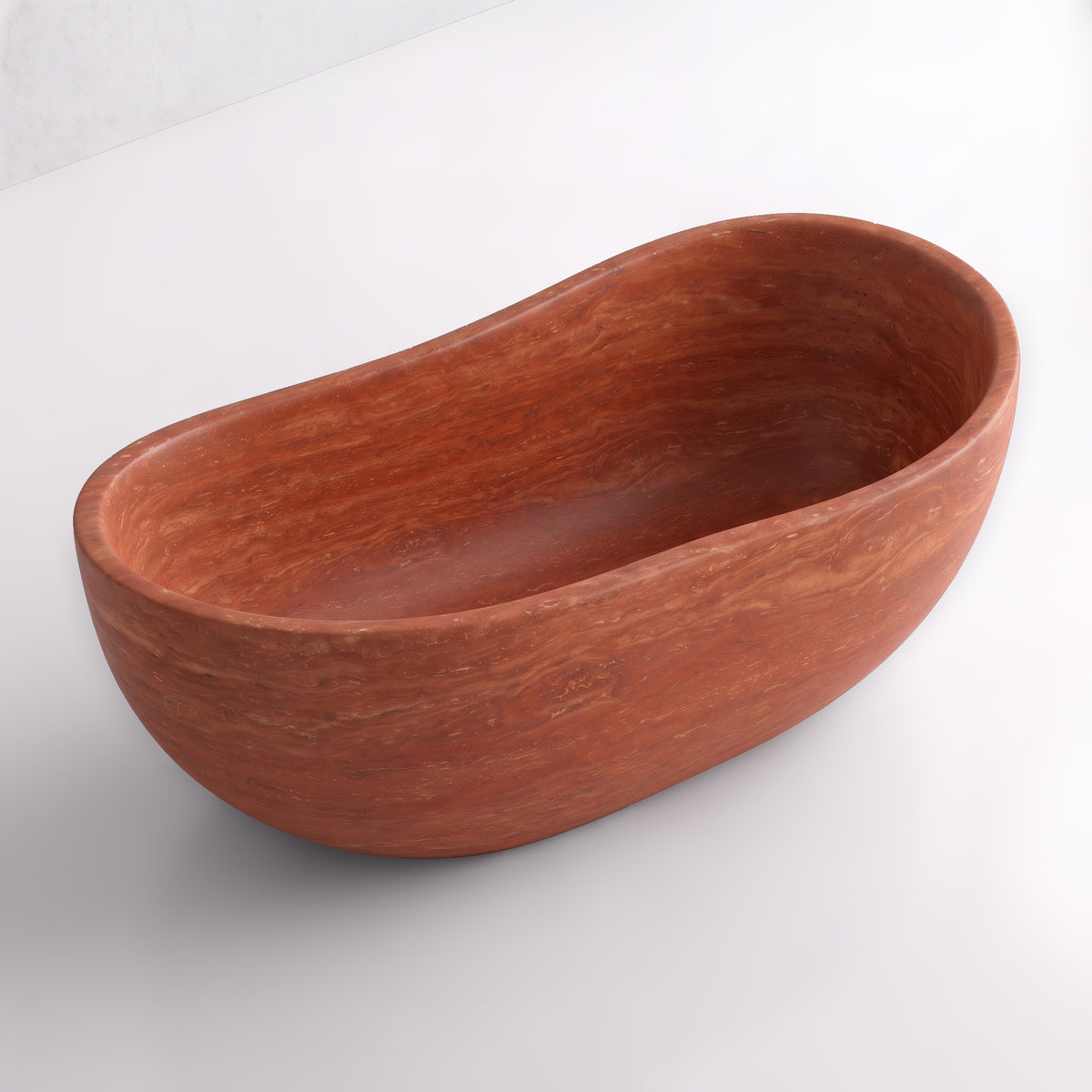 Elevated three-quarter perspective view of the Red Travertine wave soaking tub, highlighting the asymmetrical undulating rim, seamless solid-carved interior, and continuous horizontal sedimentary banding.