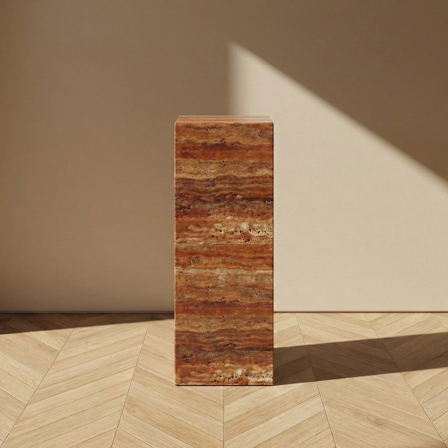 A direct, front-facing view of a Red Travertine pedestal stand against a neutral wall, emphasizing the striking "sunset" bands of crimson and ochre within the natural stone.