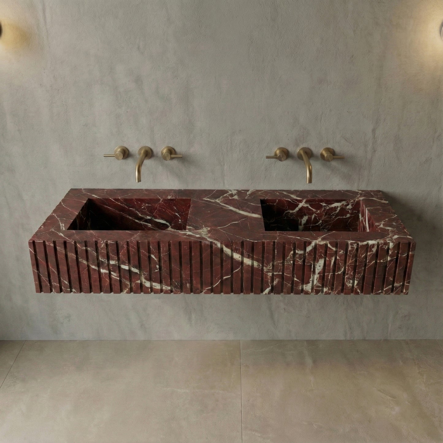 Front profile of a floating double vanity crafted from Rosso Levanto marble, displaying a custom vertical ribbed apron and striking white lightning veins.