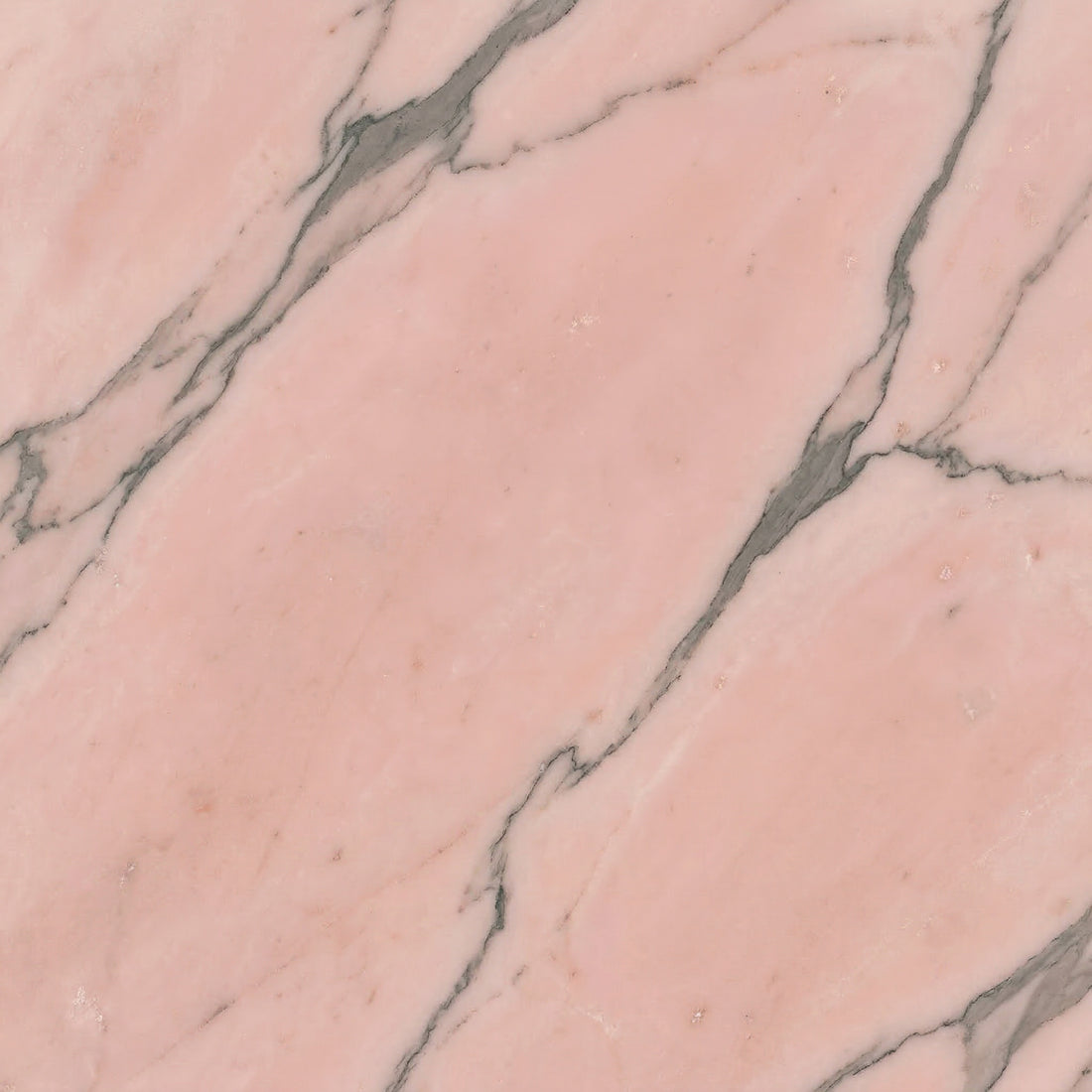 Soft salmon pink Rosso Portugal marble with subtle grey and brown veining, perfect for elegant bathroom vanities and classic floor tiles.